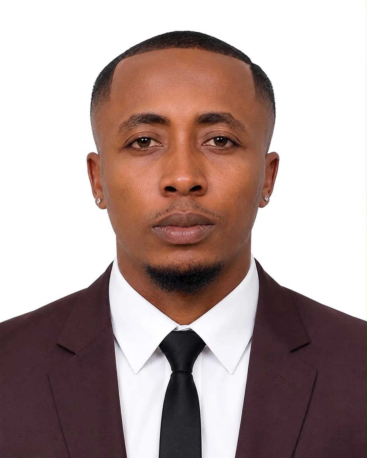 Formal portrait of Tahnwi Lesley in a dark suit