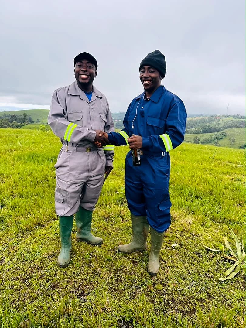 Tahnwi Lesley standing on open land during a field visit